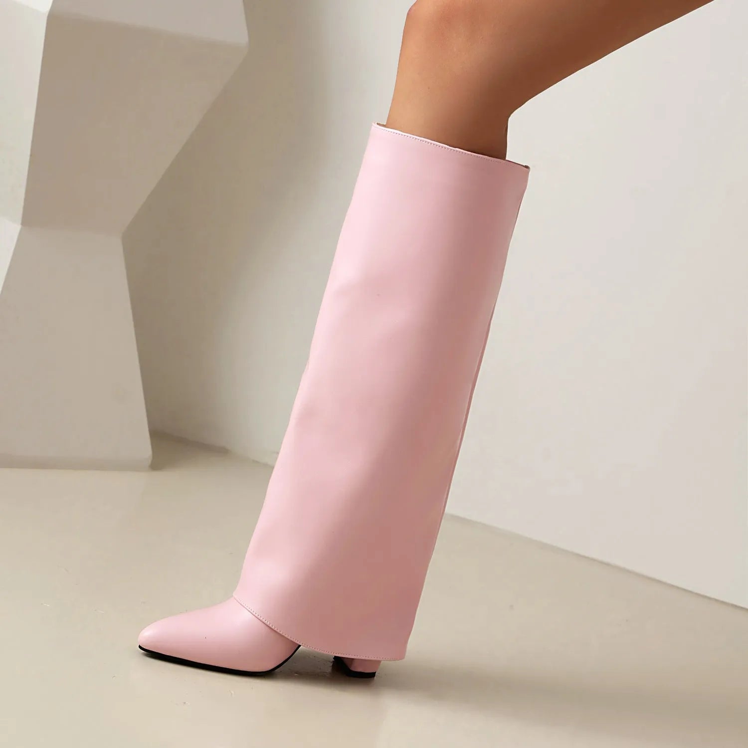 Women's plus size black high heel boot with high shaft and sewing line detailing on artificial PU material.
