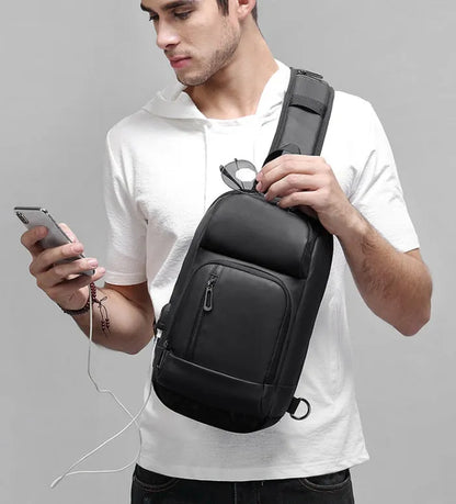Black outdoor leisure shoulder bag with air cushion strap and multiple internal compartments
