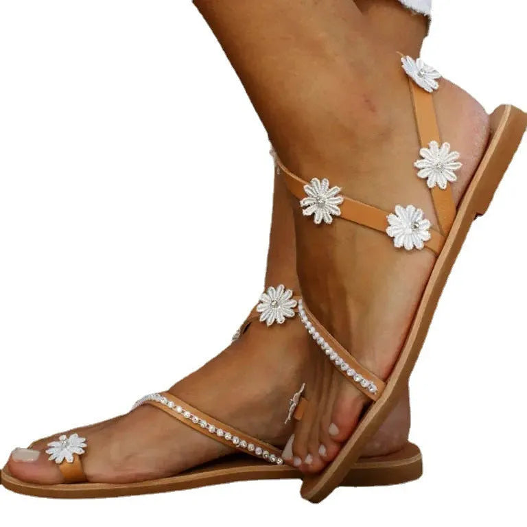 Brown women's Roman sandals with floral pattern, herringbone toe design, artificial PU upper and rubber sole