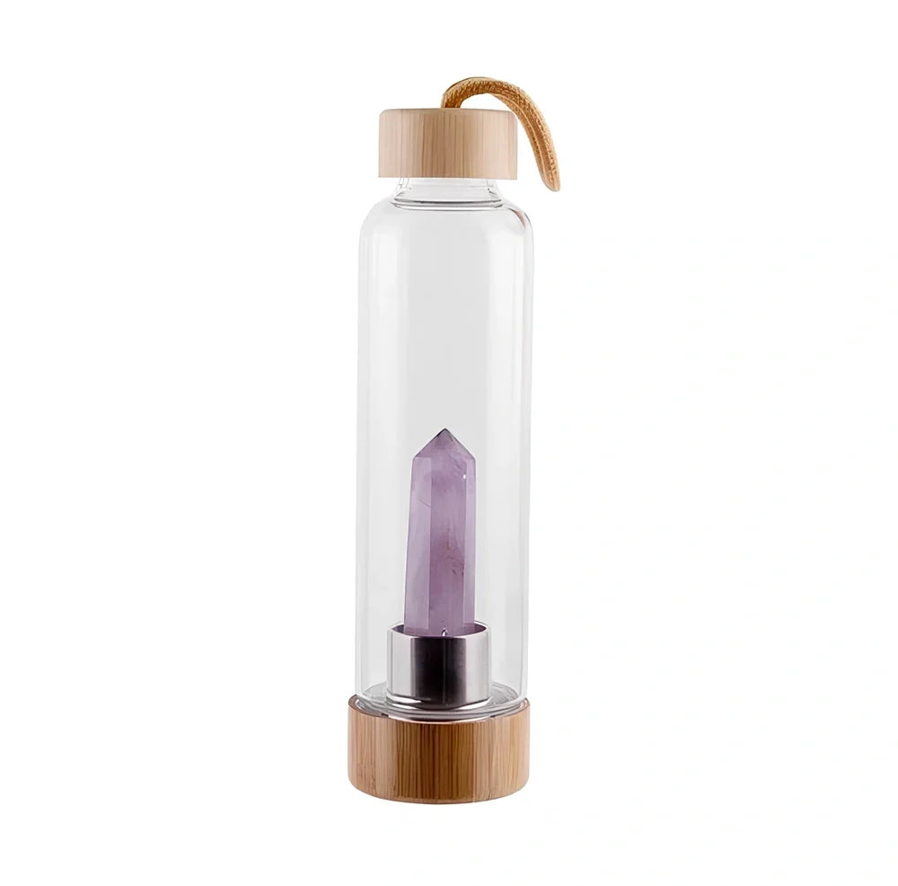 Crystal infused glass water bottle with bamboo lid showing mineral crystal inside 25cm tall container