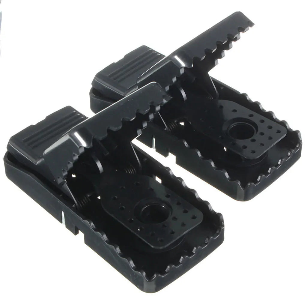 Six black plastic snapping mousetraps showing quick-kill mechanism and compact 11cm size