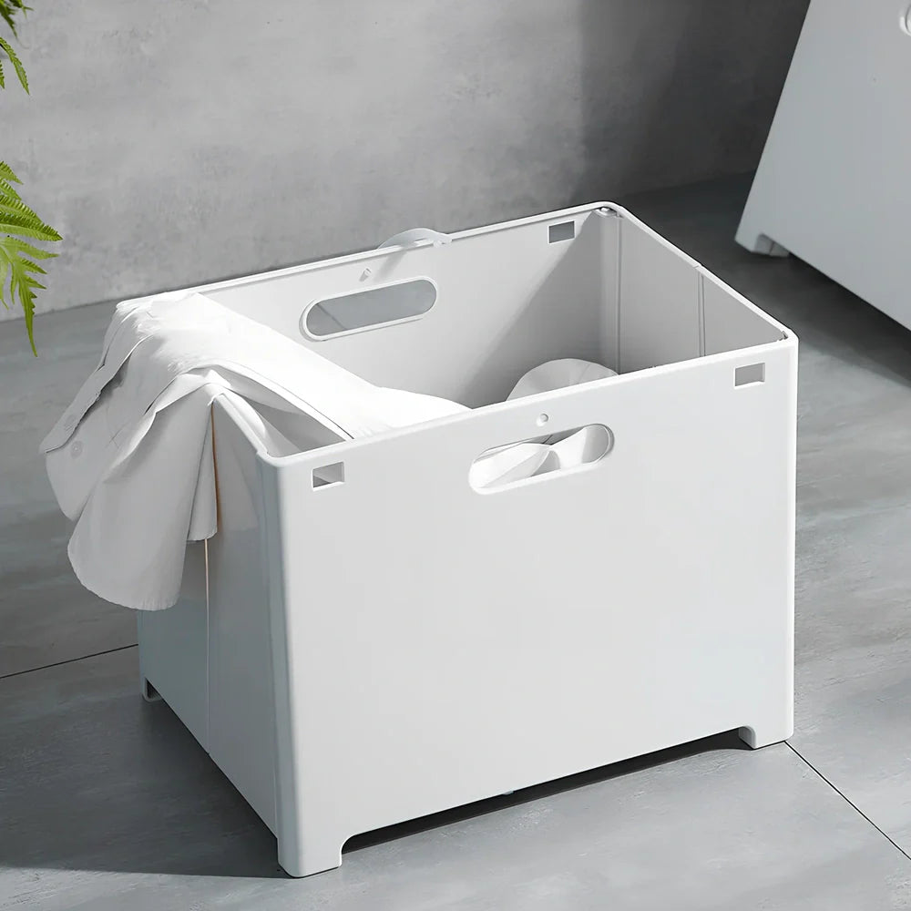 White wall-mounted bathroom storage cabinet with integrated table surface for laundry organisation