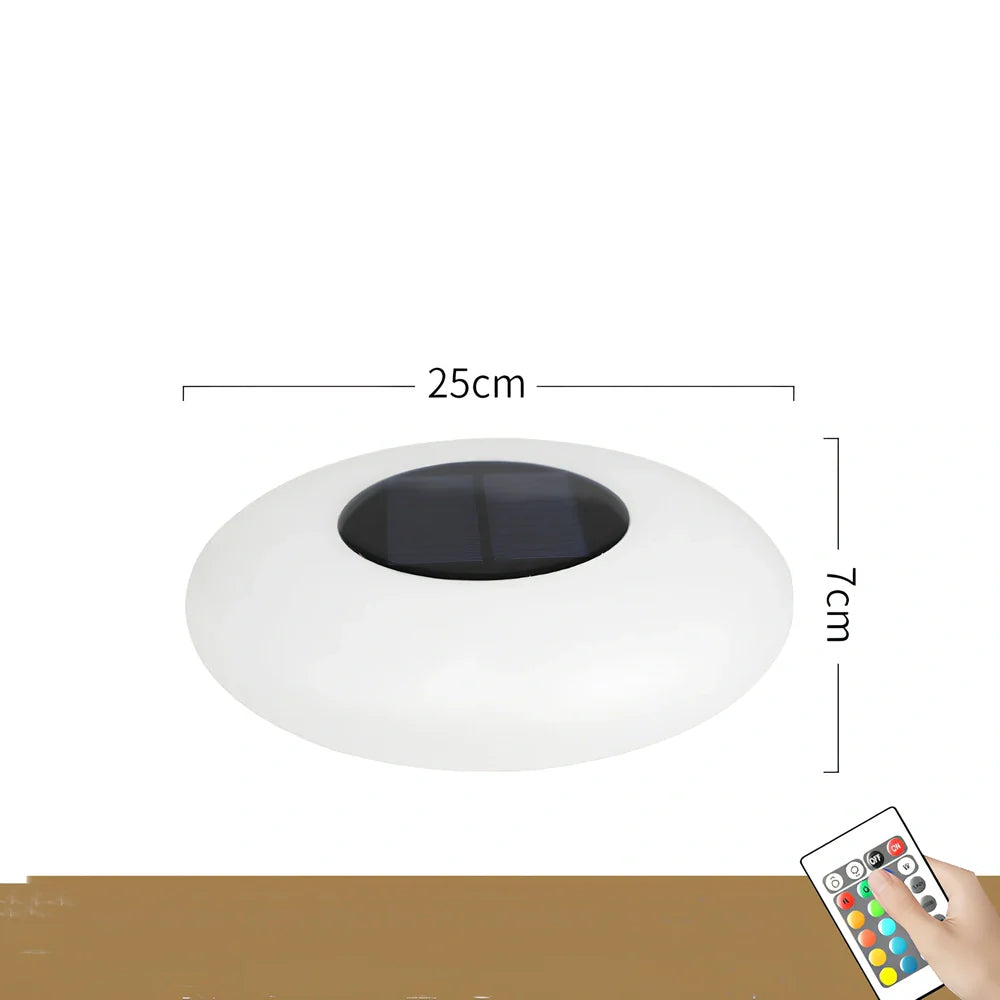 White solar lawn light with UFO design for garden illumination, 300mm diameter with remote control