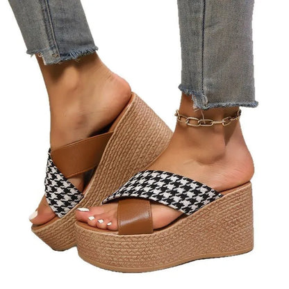 Brown and black cross leopard plaid pattern on casual wedge sandals with a rubber sole.