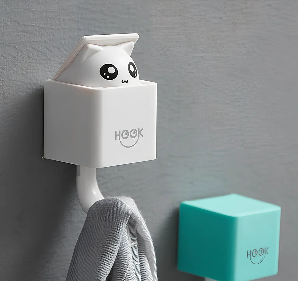 Blue cat-shaped adhesive wall hook measuring 5x5x7.5cm with 3M backing for damage-free installation