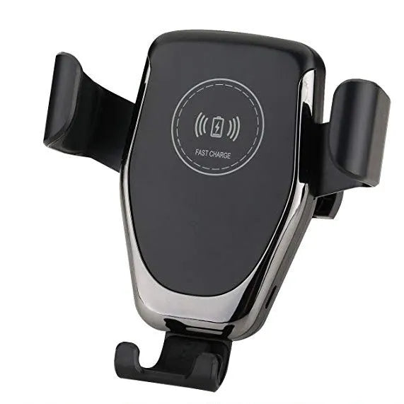 Black car phone mount with automatic clamp holding an iPhone on a car air vent, charging wirelessly.