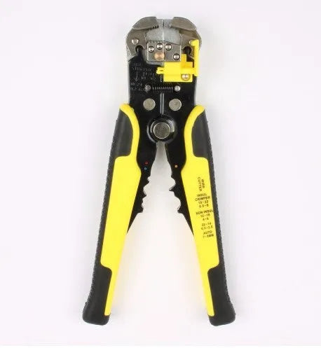 Yellow automatic 3-in-1 wire stripper and crimping plier tool on a workbench