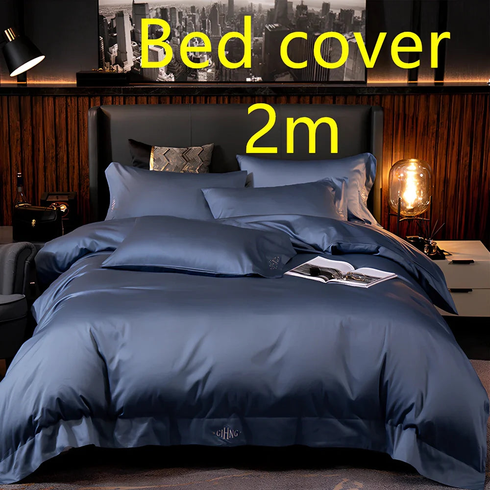 Four-piece quilted cotton bed set in royal blue, showing 200x230 cm cover and 48x74 cm pillowcases for 1.5m bed