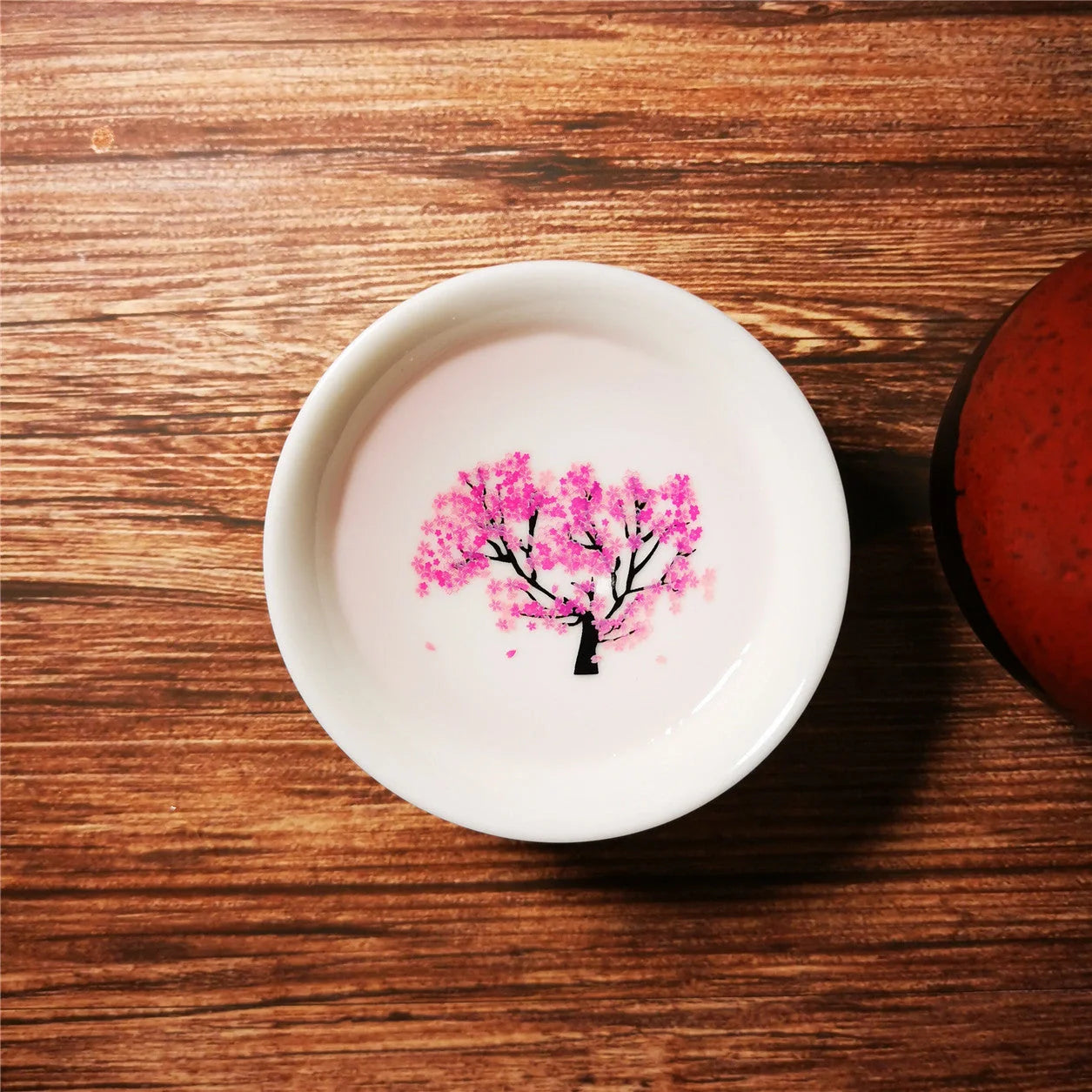 Magic Sakura Cup - Japanese color-changing ceramic teacup with sakura design