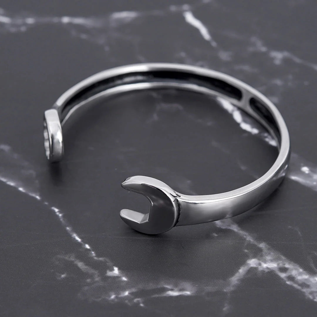 Sleek stainless steel personalized wrench bracelet with adjustable clasp, showcasing industrial-chic style