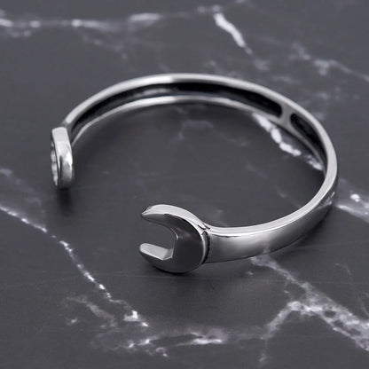 Sleek stainless steel personalized wrench bracelet with adjustable clasp, showcasing industrial-chic style