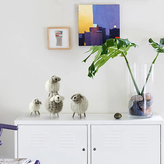 Adorable plush sheep decorations in various sizes and color combinations, perfect for adding a cozy, farmhouse-inspired touch to any home.