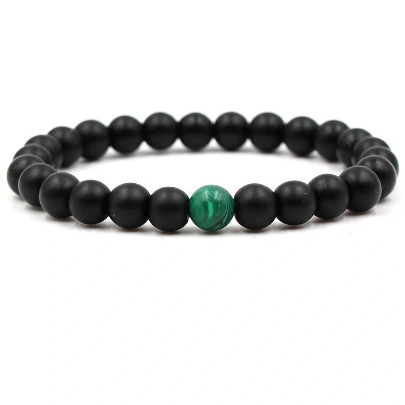 Elegant malachite stone bracelets with unique textures and patterns, perfect for a stylish accessory.