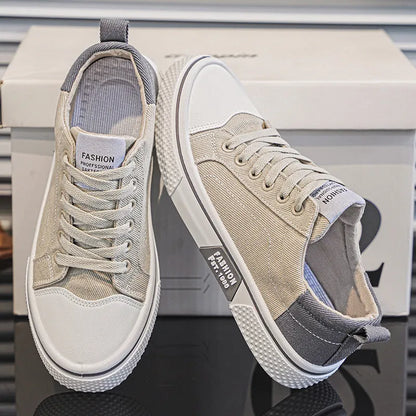 Men's low-top blue canvas skate shoes with round toe and flat heel on a white background.