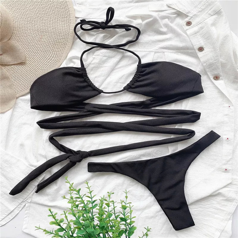 Strappy solid color bikini for women in black, featuring quick-drying polyester fabric.