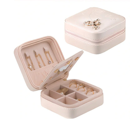 Three-layer travel jewellery box with PU leather exterior and secure closure for organised accessory storage