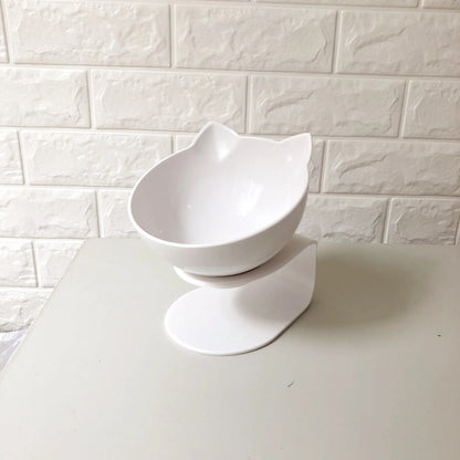 An inclined cat food bowl with a transparent design and a sturdy base, providing a comfortable and hygienic dining experience for your feline friend.