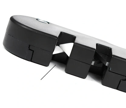 Black Pocket Pal knife sharpener showing carbide blades, ceramic stones, and tapered diamond rod on 3.5-inch compact unit