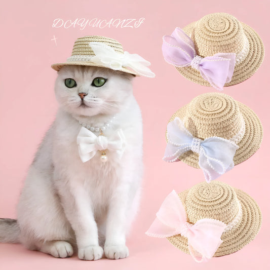 A woven Lafite leaf hat for cats with a pearl butterfly bow, shown in pink, purple, blue, and white colour options.