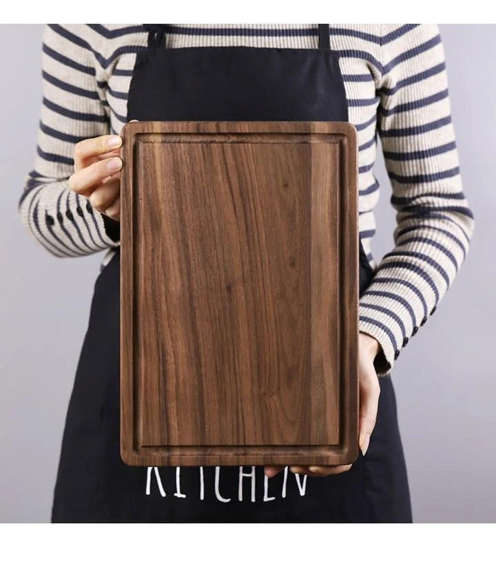 Premium black walnut wood cutting board with a versatile 2-sided design for chopping, slicing, and serving in the kitchen