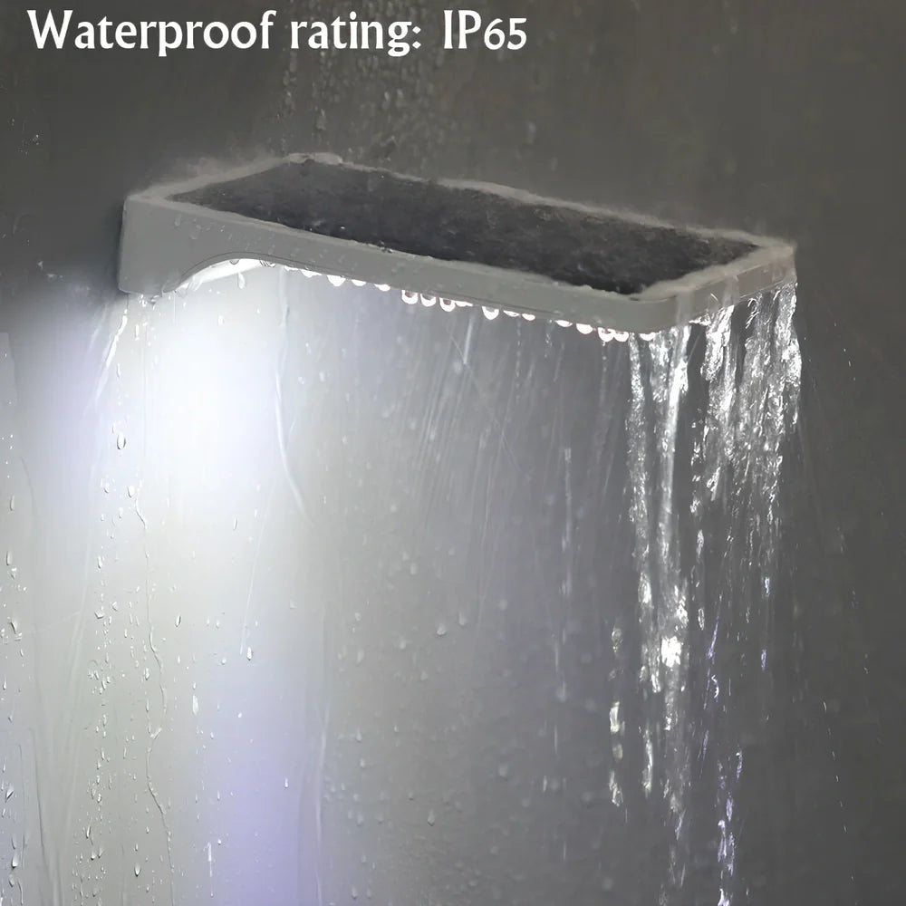 Black and white solar garden light with 36 LEDs, mounting rod option, automatic dusk operation