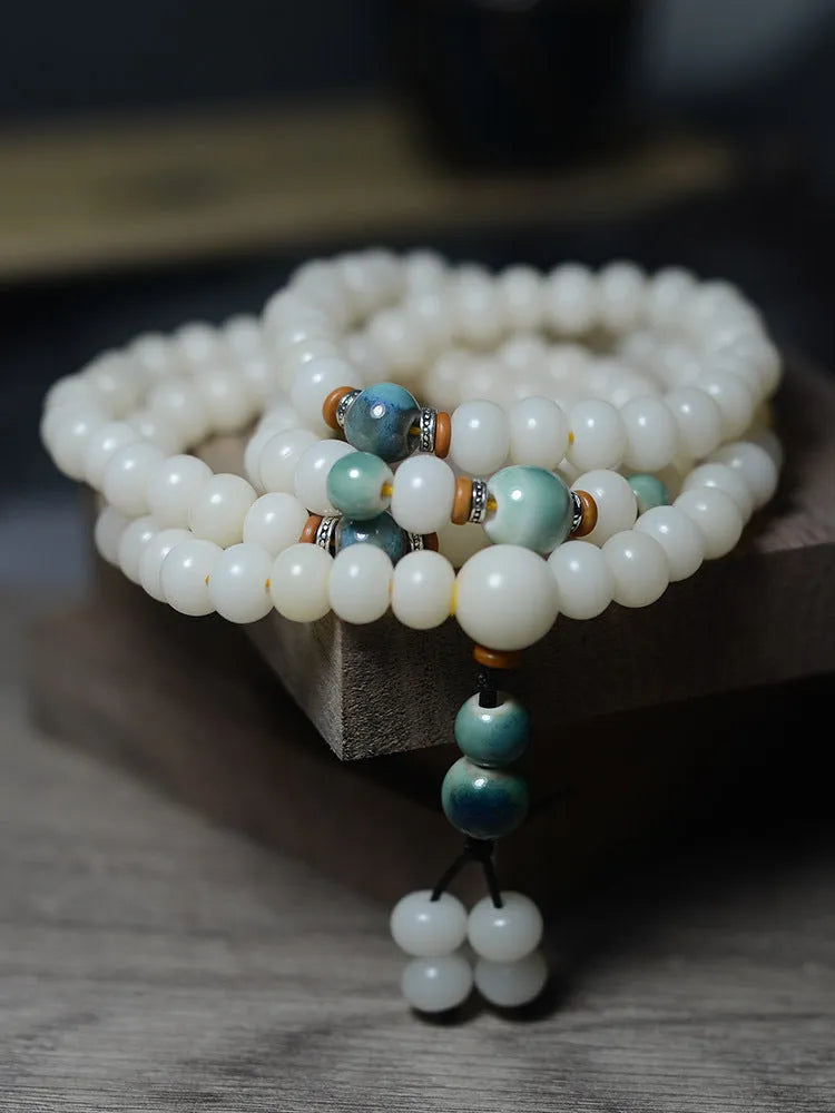 Bracelet made from bodhi seeds featuring 108 white jade oblate beads in flat round shape, available in 7x9mm or 8x10mm sizes, with national style design suitable for unisex wear, Buddhist meditation accessory