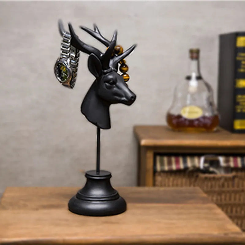 Natural resin animal sculpture home decoration in black, white, and wood colour finishes.