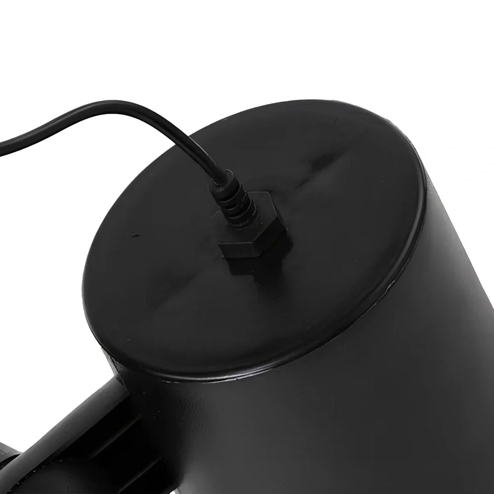 Black Christmas projection light with starry laser pattern on brick wall, 13.5cm unit with 29cm handle