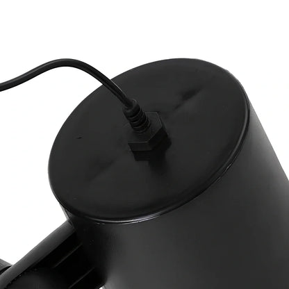 Black Christmas projection light with starry laser pattern on brick wall, 13.5cm unit with 29cm handle