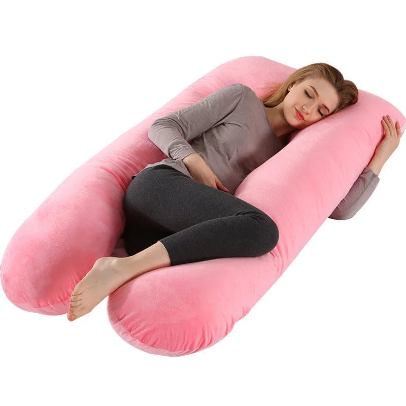 Large U-shaped pregnancy support pillow with removable cover and abdominal support belt.