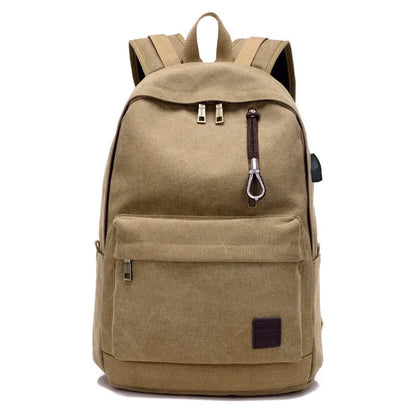 Coffee-coloured canvas backpack with USB charging port on side strap and front zipper pocket.