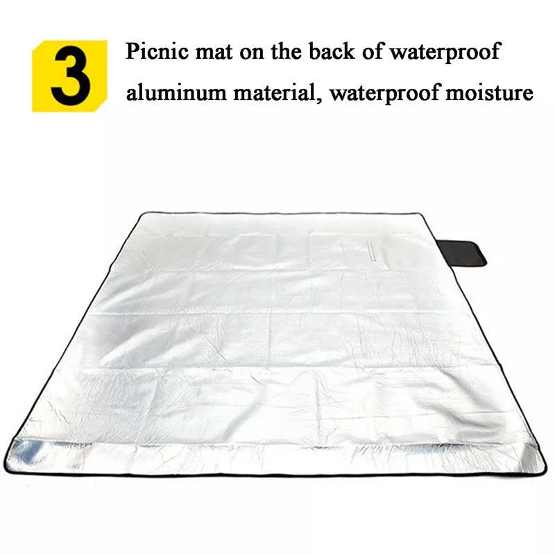 Folding Suede Picnic Moisture-proof Mat in blue stripes, unfolded on grass