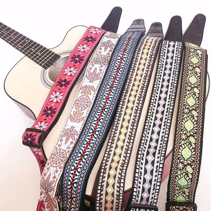 Adjustable embroidered guitar strap with durable webbing and intricate design