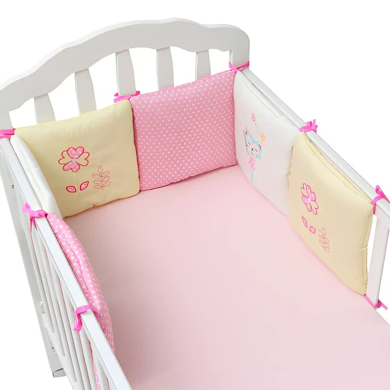Six 30x30cm cotton baby bed protection panels with hard cotton filling arranged around crib