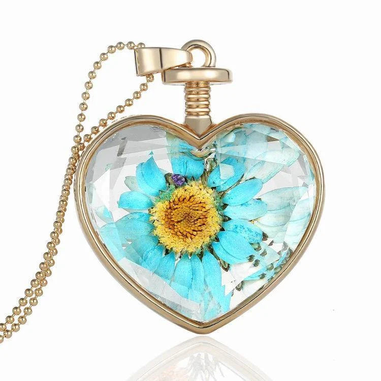 Elegant round pendant necklace with dried flower specimen in various colors including yellow, blue, purple, red, and orange