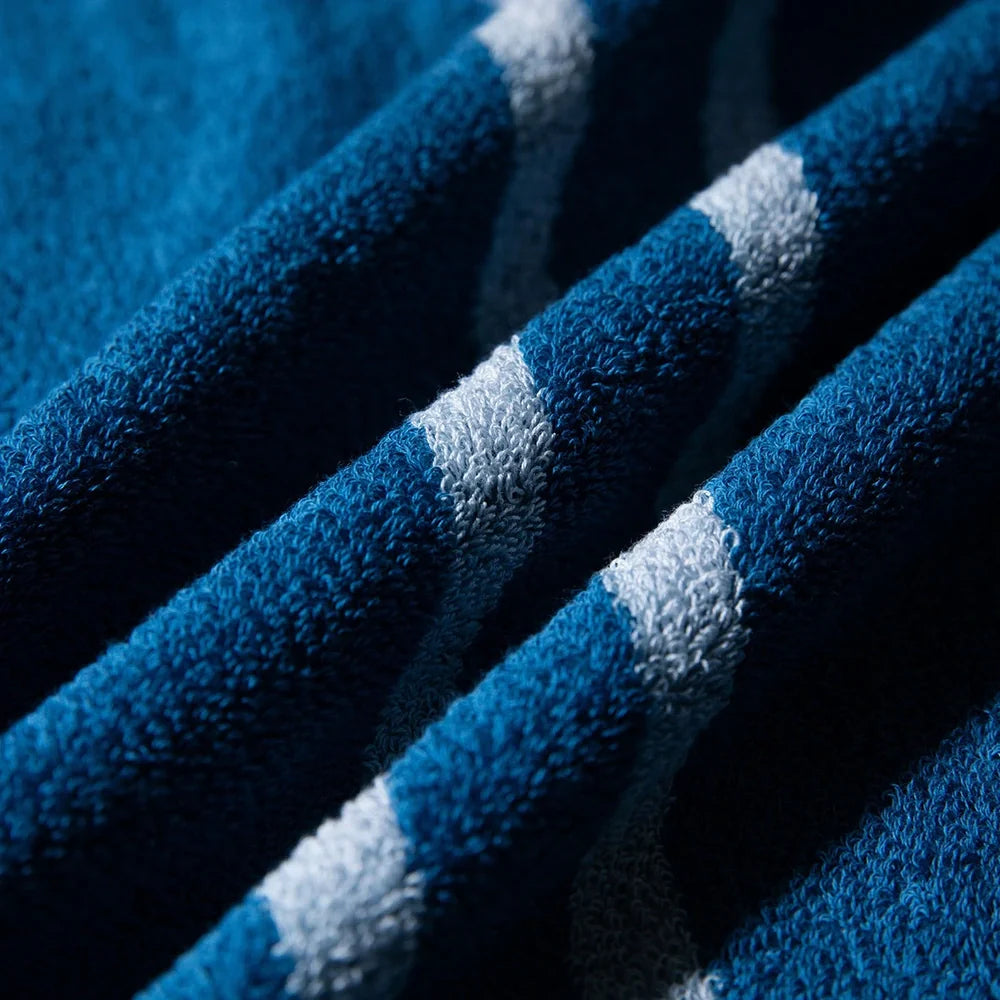 Blue smart sensor cotton towel measuring 34cm by 74cm with 100% cotton composition