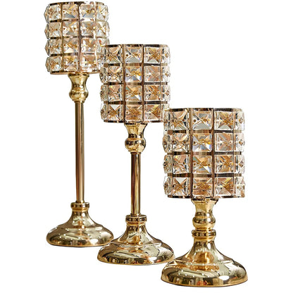 Three golden metal candle holders in small 21 cm, medium 31 cm, and large 36 cm sizes with 11x11 cm bases for table decor