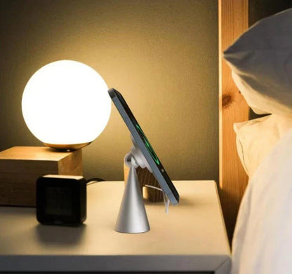 Magnetic phone stand for iPhone 12 and up, made of sleek aluminum alloy with 360-degree rotation for hands-free charging and viewing
