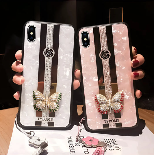 Pearl coloured acrylic iPhone case featuring a butterfly design with diamonds and a rectangular mirror.