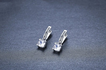 Elegant copper-plated square zircon stud earrings in a modern, natural design