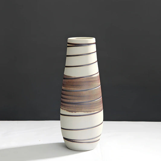 Three ceramic vases in graduated sizes: low, medium, and tall vintage designs