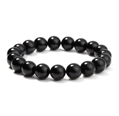 Geometric black agate bracelet for women with 8mm beads on a black elastic cord.
