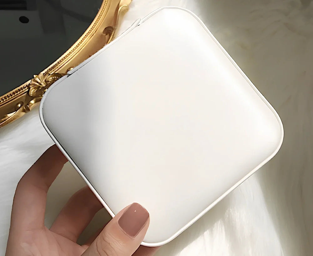 Three-layer travel jewellery box with PU leather exterior and secure closure for organised accessory storage