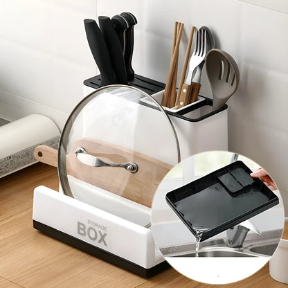 White plastic desktop kitchen knife storage rack with integrated shelf and individual partitions.