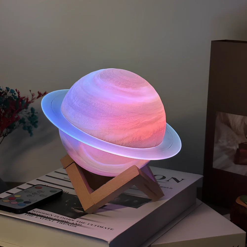 Rings of Saturn Dream Bluetooth Speaker showing 16.5cm dimensions with remote control and bracket accessories