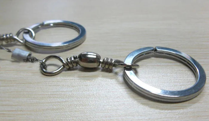 Outdoor survival wire saw with stainless steel blade and pull ring handles for camping and bushcraft