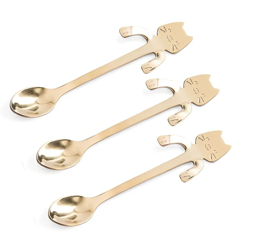 Stainless steel coffee spoon with cartoon cat handle design showing 11.7cm measurement scale