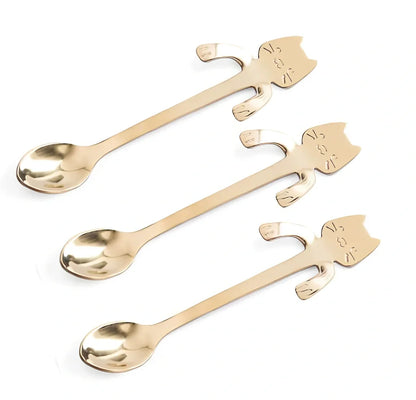 Stainless steel coffee spoon with cartoon cat handle design showing 11.7cm measurement scale