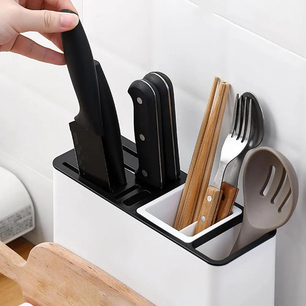 White plastic desktop kitchen knife storage rack with integrated shelf and individual partitions.