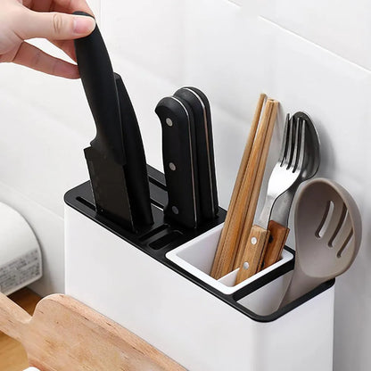 White plastic desktop kitchen knife storage rack with integrated shelf and individual partitions.